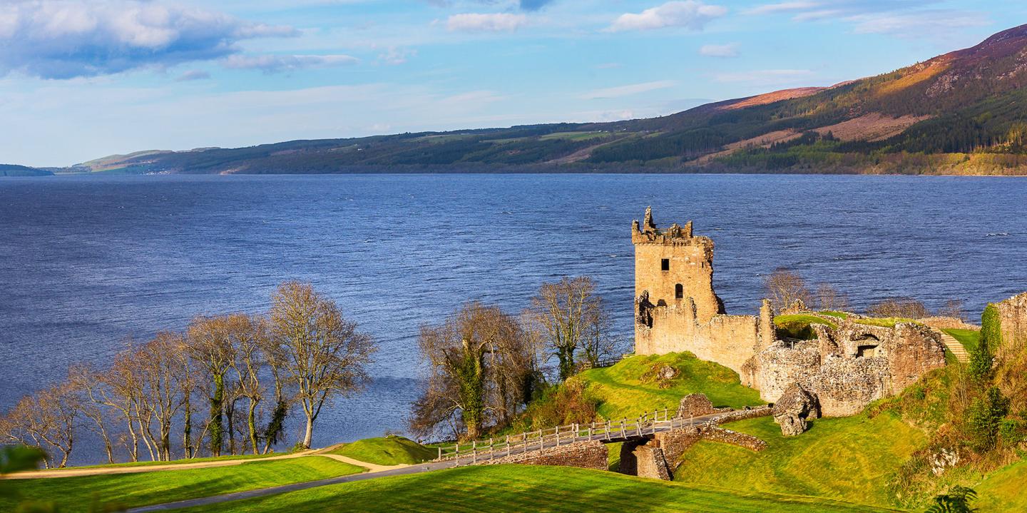 Urquhart Castle With Loch Ness In The Background